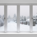 snowy landscape seen through a house window